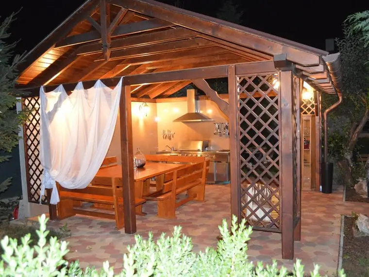 Gazebo with seating and grill